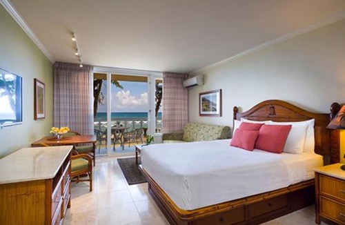 Wailua Resort | Beachfront is set amid palm trees on 6 acres of beautifully landscaped gardens!