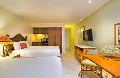 Wailua Resort | Beachfront is set amid palm trees on 6 acres of beautifully landscaped gardens!