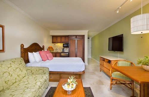 Wailua Resort | Beachfront is set amid palm trees on 6 acres of beautifully landscaped gardens!