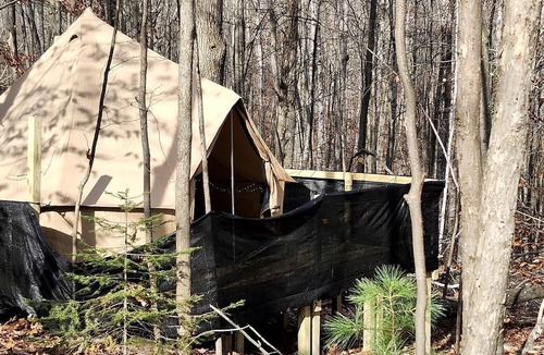 Mio RV Rental | Cozy Bell Tent Glamping on Private Fenced Deck with Bathhouse Firepit WiFi and Trails in Mio, Michigan