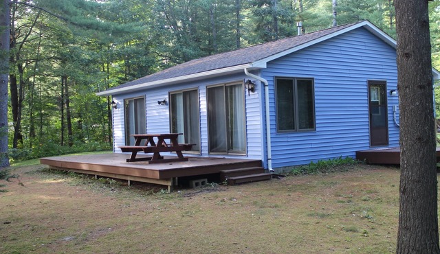 Quiet Lakefront Cabin with Private Fire Pit, Beach and Dock in Alger