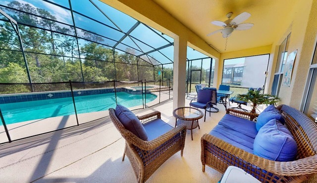 Sprawling home with pool, pool spa, & game room - athletic court and gym access in Kissimmee