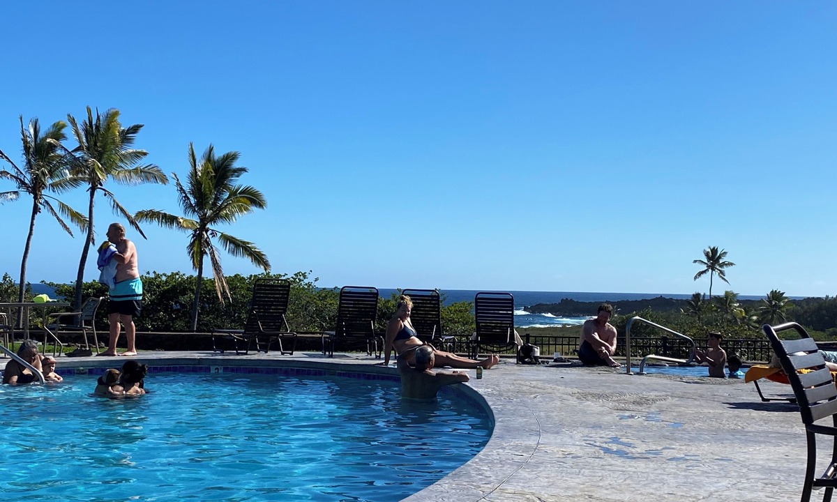 Punaluu Condo | Secluded , cozy poolside getaway. Ocean views, near black sand beach & turtles.