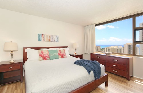 Waikiki Condo | Partial Ocean View, one-bedroom with AC, Wi-Fi, parking, short walk to beach!